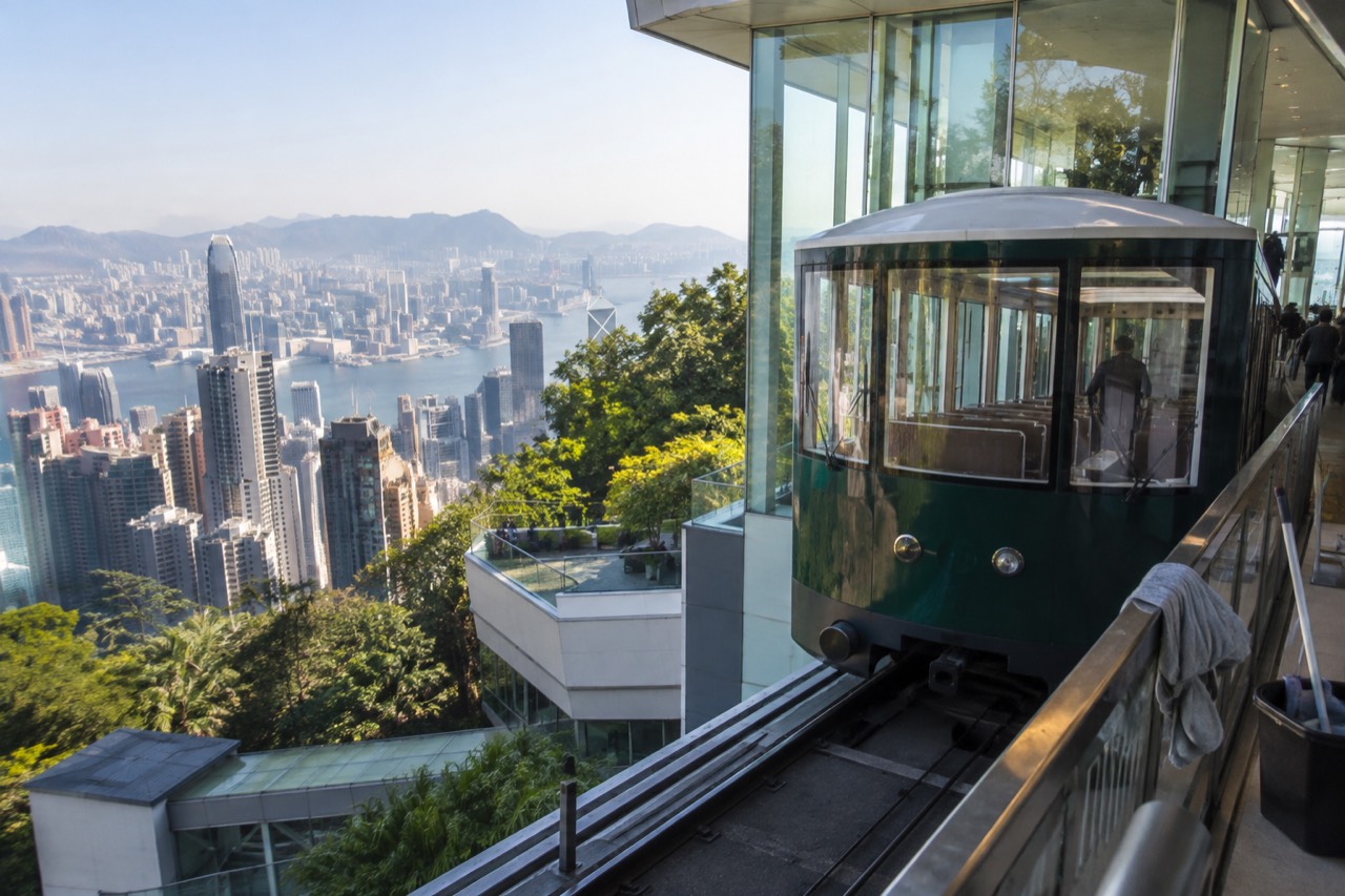 Green Peak Tram funicular car at the upper terminus building on Victoria Peak