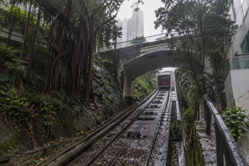 Track and haulage machinery of the Peak Tram funicular climbing the hillside