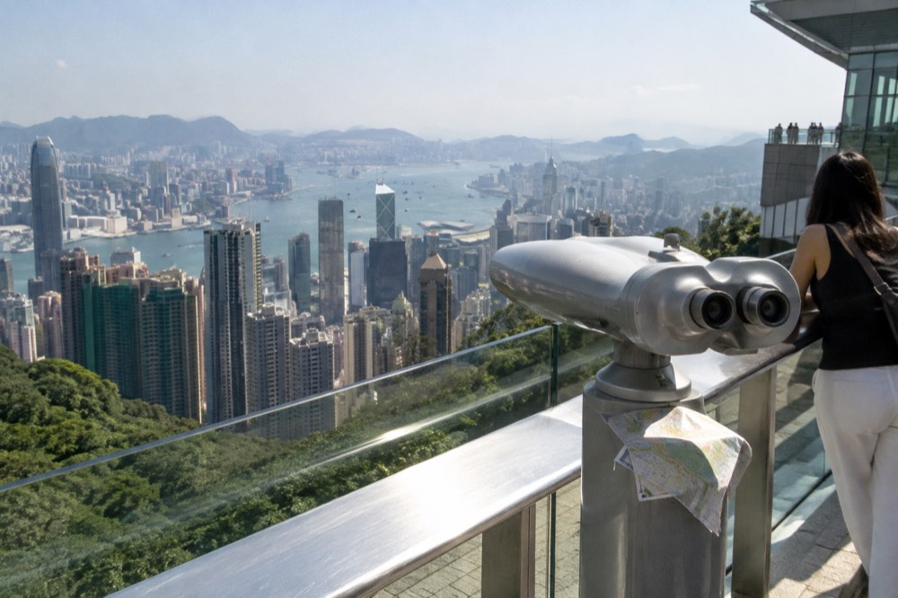 Observation deck railing with a city skyline and harbour stretching to the horizon