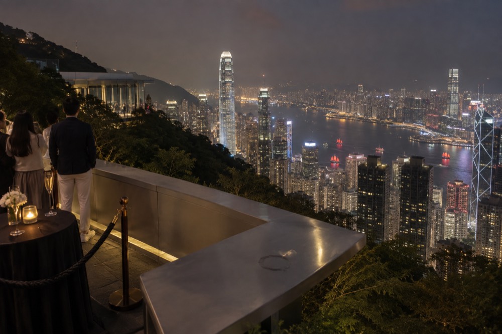 Illuminated Hong Kong skyline at night seen from a high vantage point