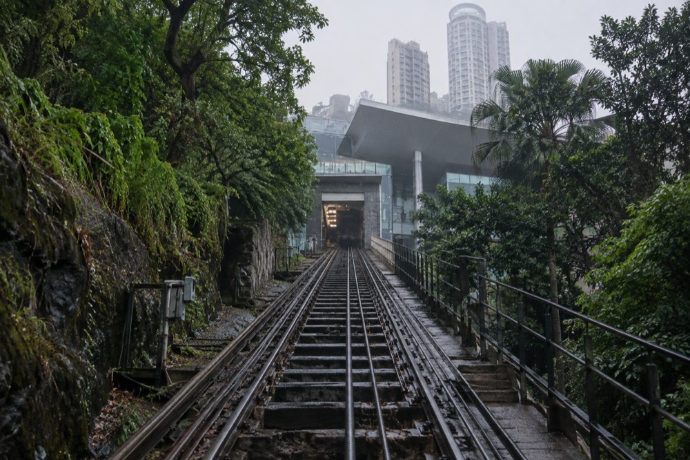Tracks of the funicular rising steeply through trees toward the upper terminus