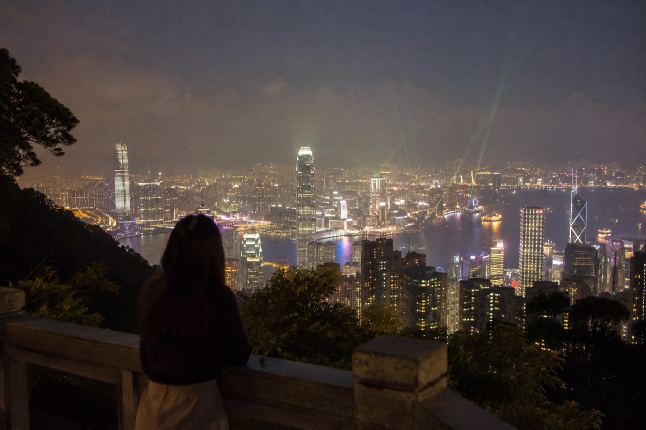 Hong Kong skyline and harbour lights seen from a hillside viewpoint at night
