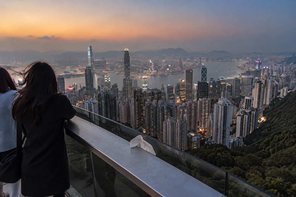 The Hong Kong skyline and harbour seen from high ground at dusk