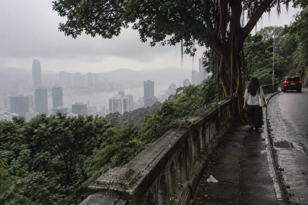 Hong Kong skyline partially obscured by haze and low cloud from a high viewpoint