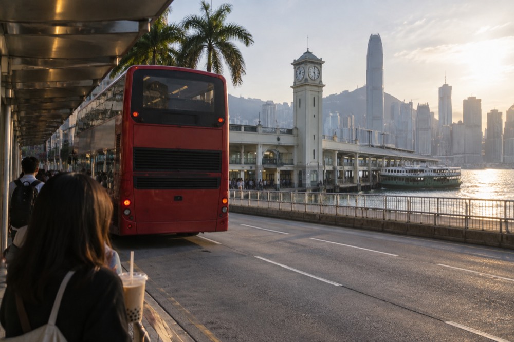 A red double-decker Citybus at a ferry pier bus stop in Central Hong Kong