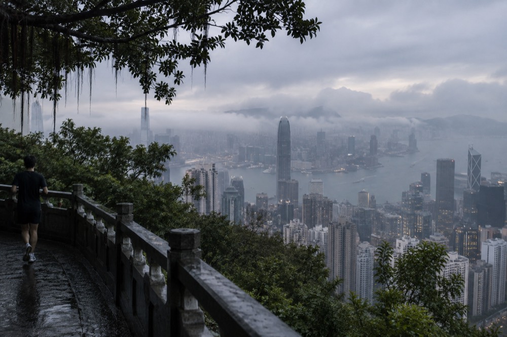 Clouds drifting over the Hong Kong skyline seen from a Peak viewpoint
