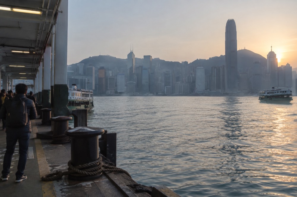 Star Ferry terminal at Tsim Sha Tsui with the harbour and Hong Kong Island skyline beyond