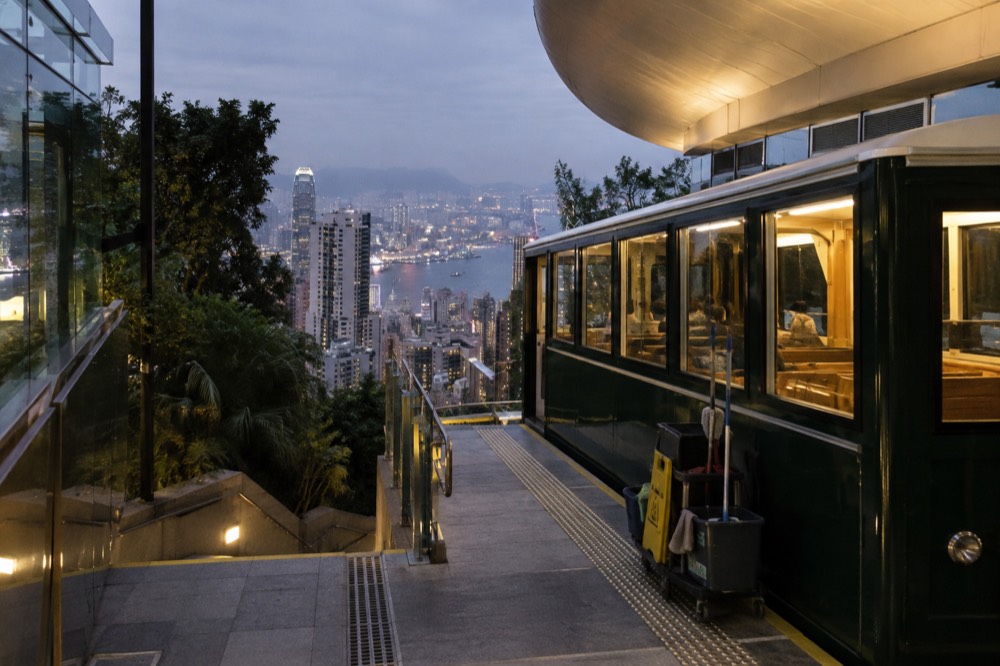 Peak Tram funicular car at the upper terminus building at Victoria Gap