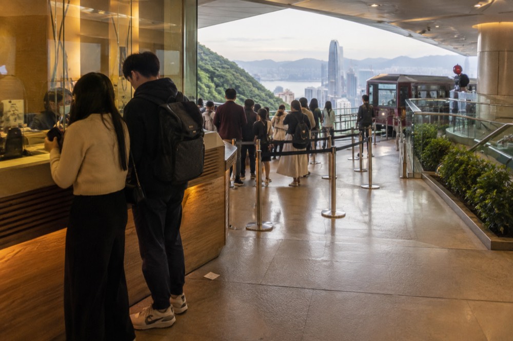 Ticket counter and signage at a hilltop attraction entrance