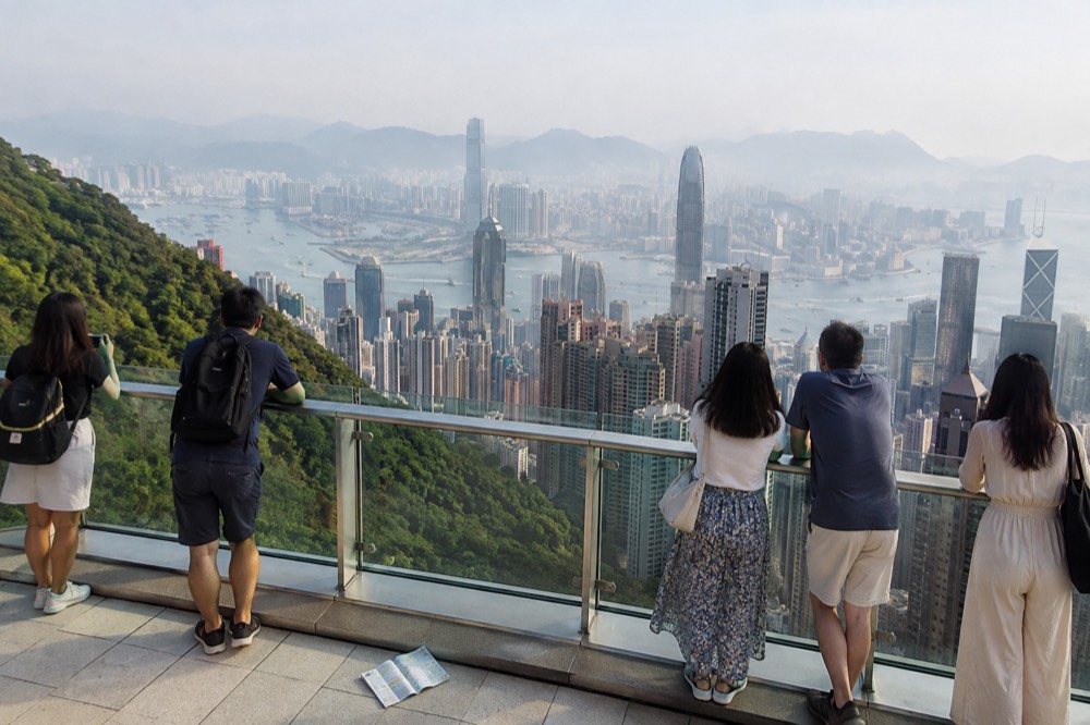 Rooftop viewing deck above harbour skyline with visitors' viewpoint railings and open sky
