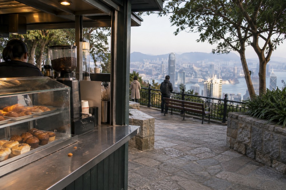 Casual cafe counter with pastries and coffee on display