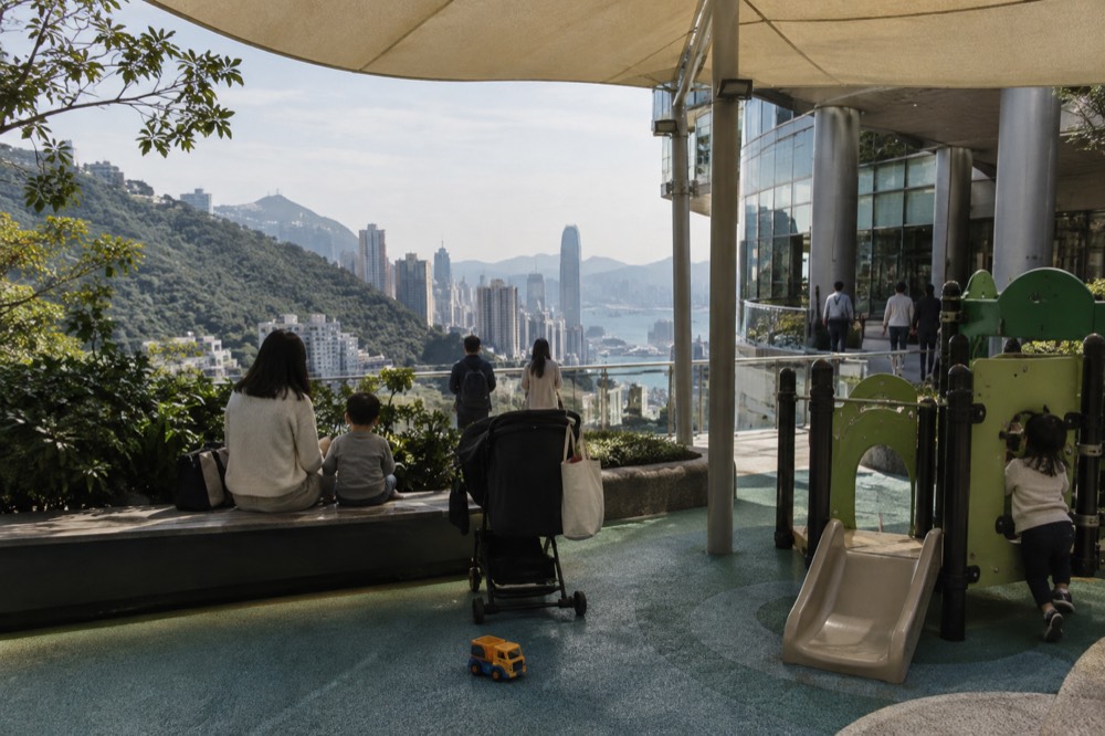 Family-friendly outdoor seating beside a playground area